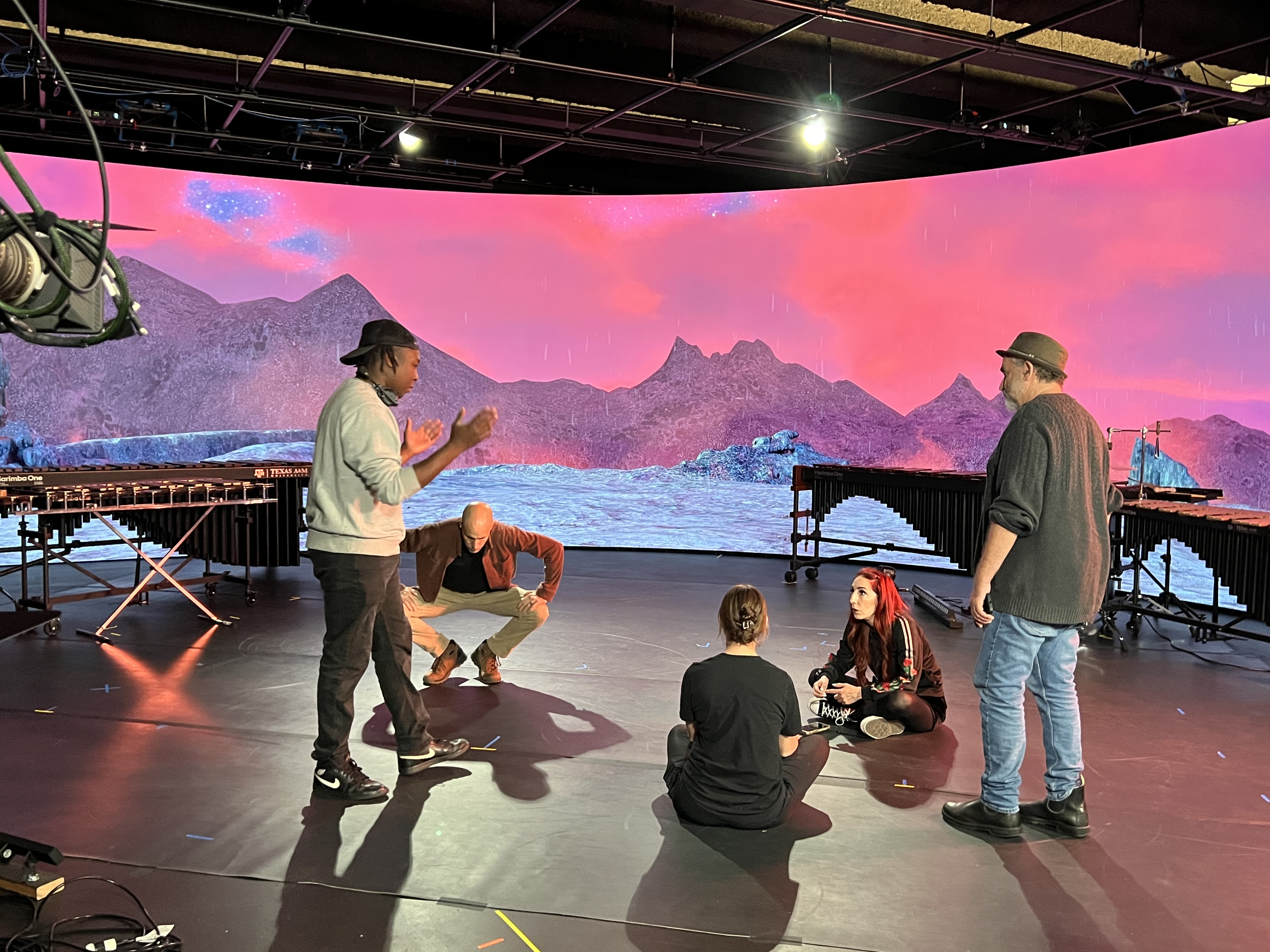 Creative team meeting after first day of filming.